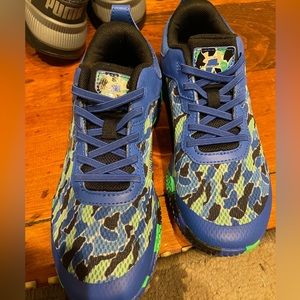 Brand new, unworn under armor boys size 2.5 shoes.